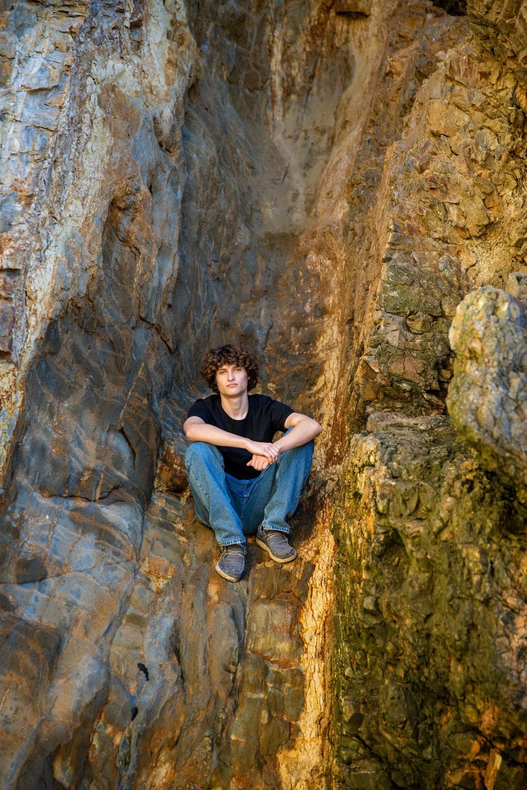 Senior boy portrait with a relaxed and confident pose